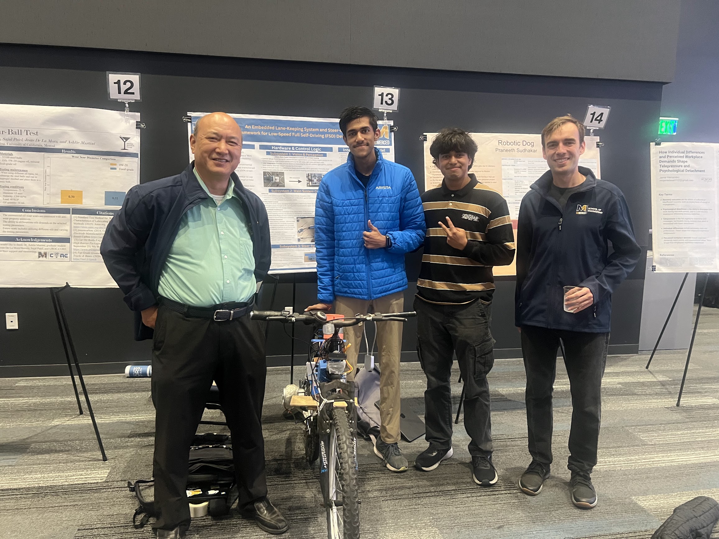 Autonomous bicycle prototype with Jetson Nano Super and steer-by-wire hardware in front of the UCM Honors Program research poster